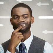 African American man thinking whether or not he should share his thoughts